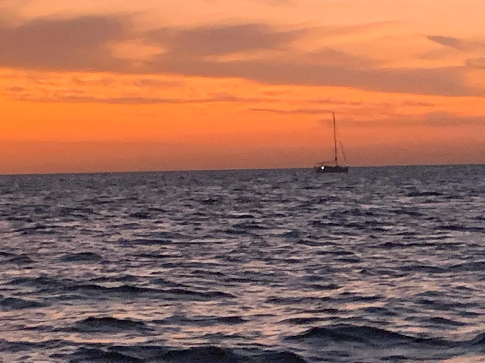 Sunset over the sea horizon